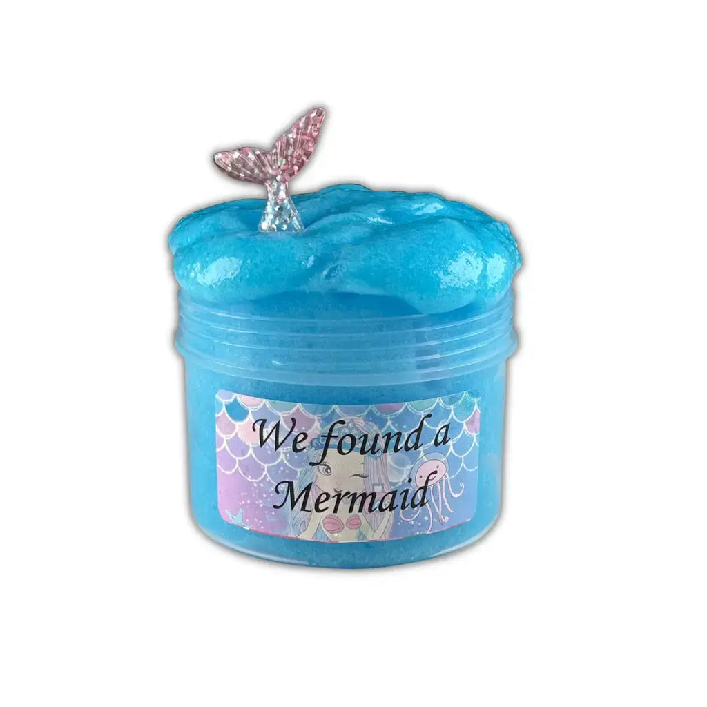Thick & playful DIY blue color slime in a container and a mermaid toy in it